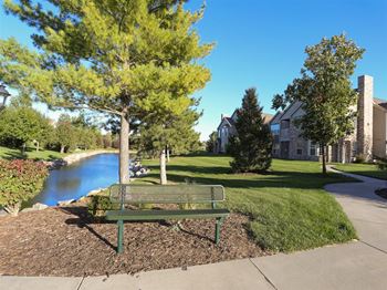 Exteriors-stone ridge estates includes a private pond with sitting bench