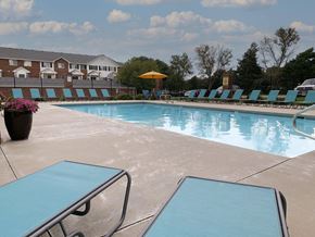 Lincoln townhouse for rent - Resort style swimming pool with sun tanning loungers at Ridge Pointe Villas in South Lincoln Nebraska