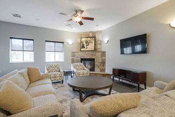 The pinebrook clubhouse lounge area with fireplace