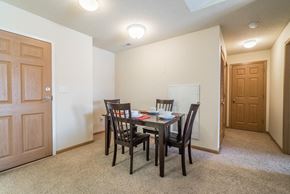 Lincoln apartment for rent - A dining room with a table set for two.