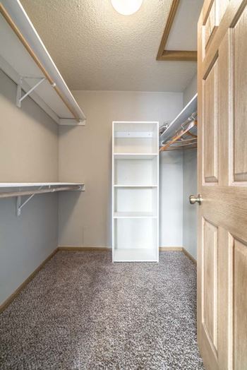 Interiors-large walk-in closet with shelving