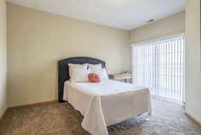 Lincoln triplex for rent - bedroom with bed and window