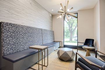 Minneapolis apartment for rent - a living room with couches and a table and a chandelier