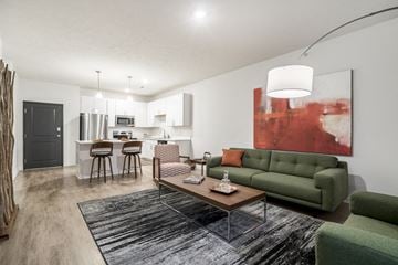 Omaha apartment for rent - a living room with a couch and a coffee table