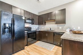 Lincoln apartment for rent - a large kitchen with stainless steel appliances and granite counter tops