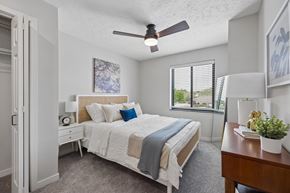Lincoln apartment for rent - Bright apartment bedroom with ceiling fan and large window.