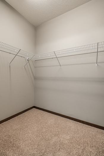 Interiors- walk in closet for extra storage at the villas at wilderness ridge in lincoln nebraska