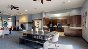 Lincoln townhouse for rent - the clubhouse with a table and chairs and a kitchen in the background