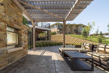 Exteriors-outdoor fireplace with pergola and seating