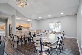 La Vista townhouse for rent - a clubhouse dining room with several tables next to a kitchen