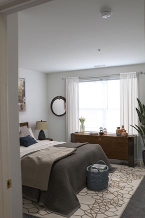 Salisbury apartment for rent - a bedroom with a bed and a dresser