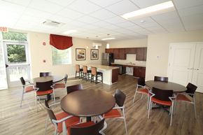 Odenton apartment for rent - A dining room with a table surrounded by chairs.