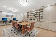 Clarksburg apartment for rent - A conference room with a table, chairs, and a computer desk.
