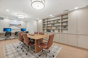 Clarksburg apartment for rent - A conference room with a table, chairs, and a computer desk.