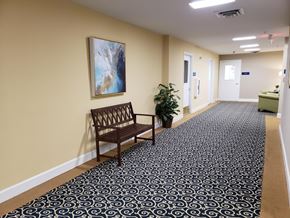 Annapolis apartment for rent - a bench in a corridor with a painting on the wall
