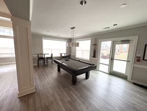 Prince Frederick apartment for rent - A spacious room with a pool table and a view of the outside.