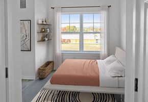 Frederick apartment for rent - a bedroom with a bed and a window