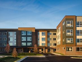 Clinton apartment for rent - an exterior view of an apartment building with a parking lot