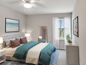 Great Mills apartment for rent - a bedroom with a bed and a ceiling fan
