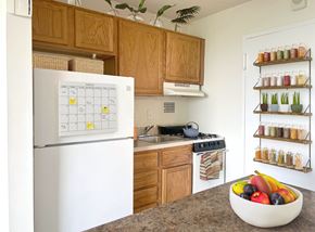 Rockville apartment for rent - A white fridge with a calendar on it in a kitchen.