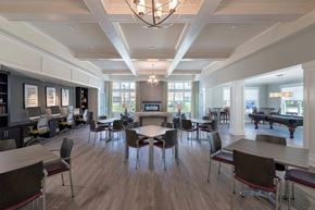 Prince Frederick apartment for rent - a large room with tables and chairs and a pool table in the background