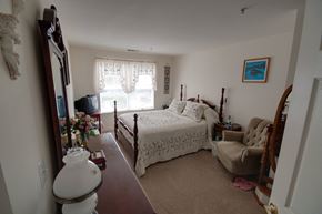 Prince Frederick apartment for rent - a bedroom with a bed and a dresser and a window