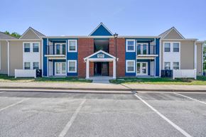 Great Mills apartment for rent - a building with a parking lot in front of it