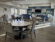 Frederick apartment for rent - a communal dining room with tables and chairs and a kitchen