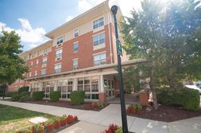 Baltimore apartment for rent - a large brick building with a sidewalk in front of it