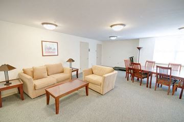 Baltimore apartment for rent - Living room with a couch, chairs, and a coffee table.