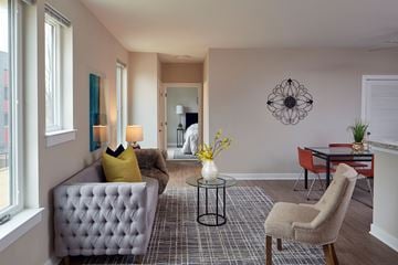 Baltimore townhouse for rent - a living room with a couch and chairs and a table