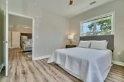 Frederick apartment for rent - A bedroom with a large bed and a window.