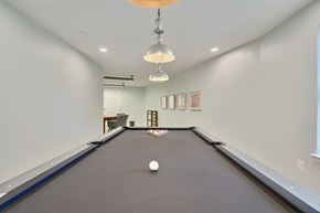 Edgewood apartment for rent - a billiards room with a pool table and two ceiling lights