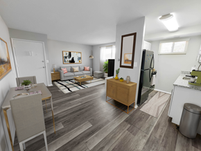 Baltimore apartment for rent - a spacious living room with hardwood flooring and white walls