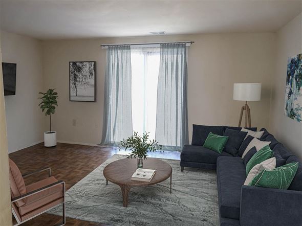 Baltimore apartment for rent - a living room filled with furniture and a large window