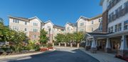 Upper Marlboro apartment for rent - A large building with a driveway in front of it.