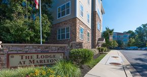 Upper Marlboro apartment for rent - The Lodge at Marlton sign in front of a building.