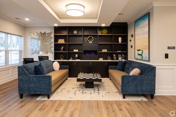 Edgewood apartment for rent - a living room with couches and a chess board
