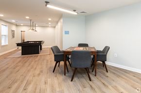 Edgewood apartment for rent - a dining room with a table and chairs and a pool table