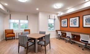 Dundalk apartment for rent - a conference room with a wooden table and chairs