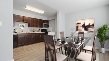 Lexington Park apartment for rent - A modern kitchen with a dining table set for four.