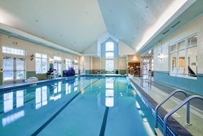 Laurel apartment for rent - a swimming pool in a building with a large window