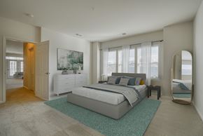 Laurel apartment for rent - a bedroom with a bed and a dresser and a mirror