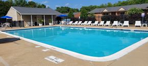 Fredericksburg apartment for rent - A large swimming pool with a white line on the ground that says "NO DIVING".