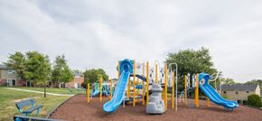 Edgewood townhouse for rent - A playground with a blue and yellow slide.