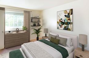 Edgewood townhouse for rent - A bedroom with a large bed and a painting on the wall.