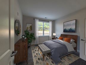 Dundalk apartment for rent - a bedroom with a bed and a dresser and a window