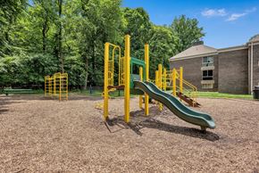 Silver Spring apartment for rent - a playground with a slide and other playground equipment