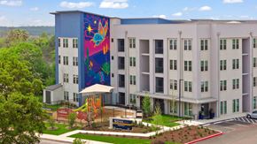 San Antonio apartment for rent - A large building with a mural on the side of it.