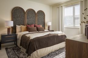 Sherman apartment for rent - A bedroom with a large bed and two lamps.